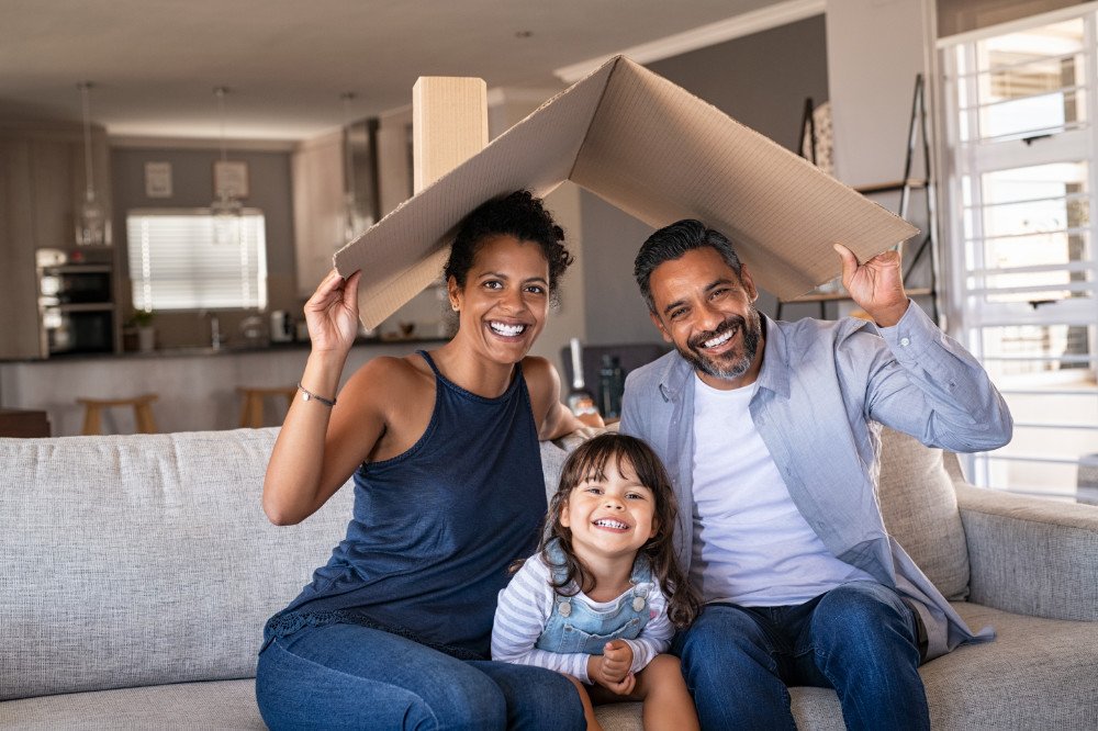 Family smiling with AAA home insurance concept image