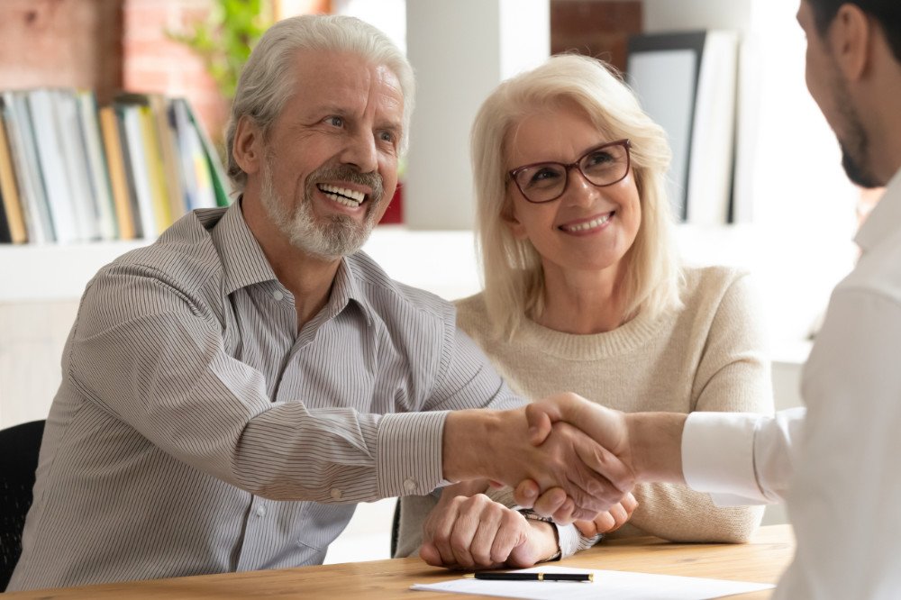 couple smiling with AAA life insurance concept image